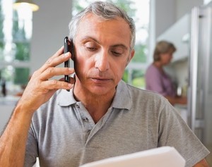man making insurance claim over phone