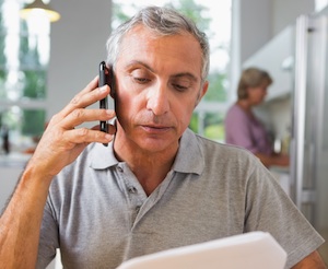 man making insurance claim over phone