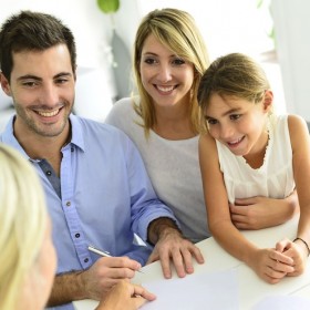 Young family discussing insurances