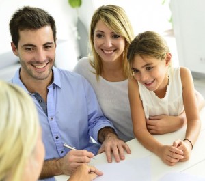 Young family discussing insurances