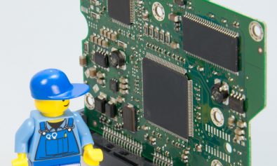 lego man with computer board